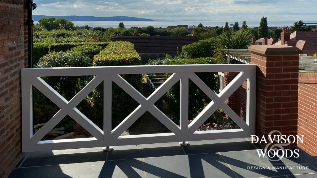 outdoor balcony made from Accoya timber finished with a teknos coating attached to red brick walls.