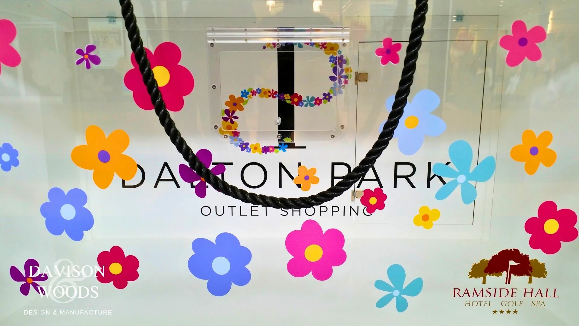 White Dalton Park Display case with glass display window and black rope handles.