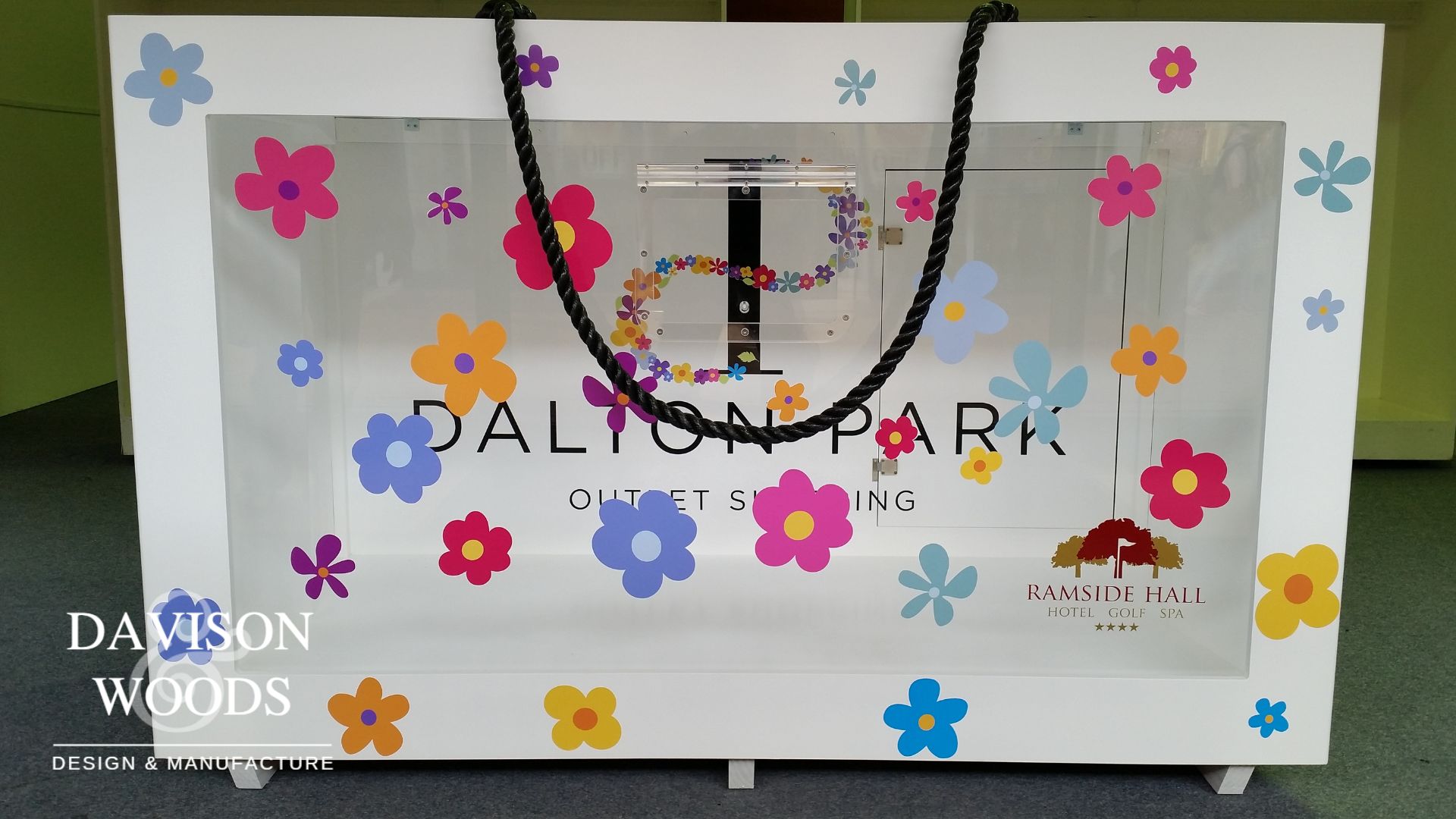 White Dalton Park Display case with glass display window and black rope handles.